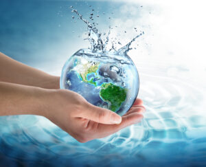 hands holding globe of water