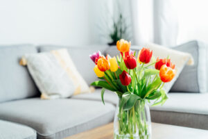 vase of tulips on living room table