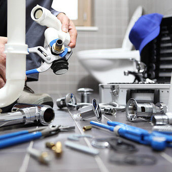 boelcke plumber working on toilet